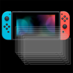 Nintendo Switch console with multiple screen protectors on a black background