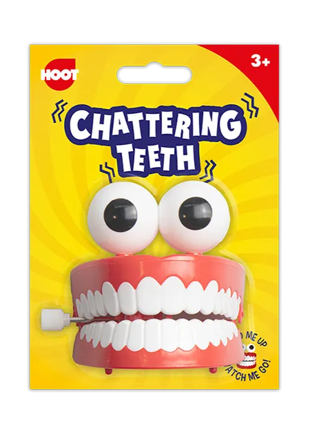 Packaged toy with 'Chattering Teeth' on a yellow background